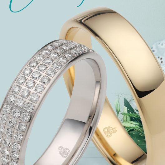 Trouwringen in geelgoud en witgoud met diamant